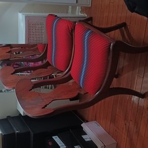 2 wooden table chairs, designed in red,blue _ white design.